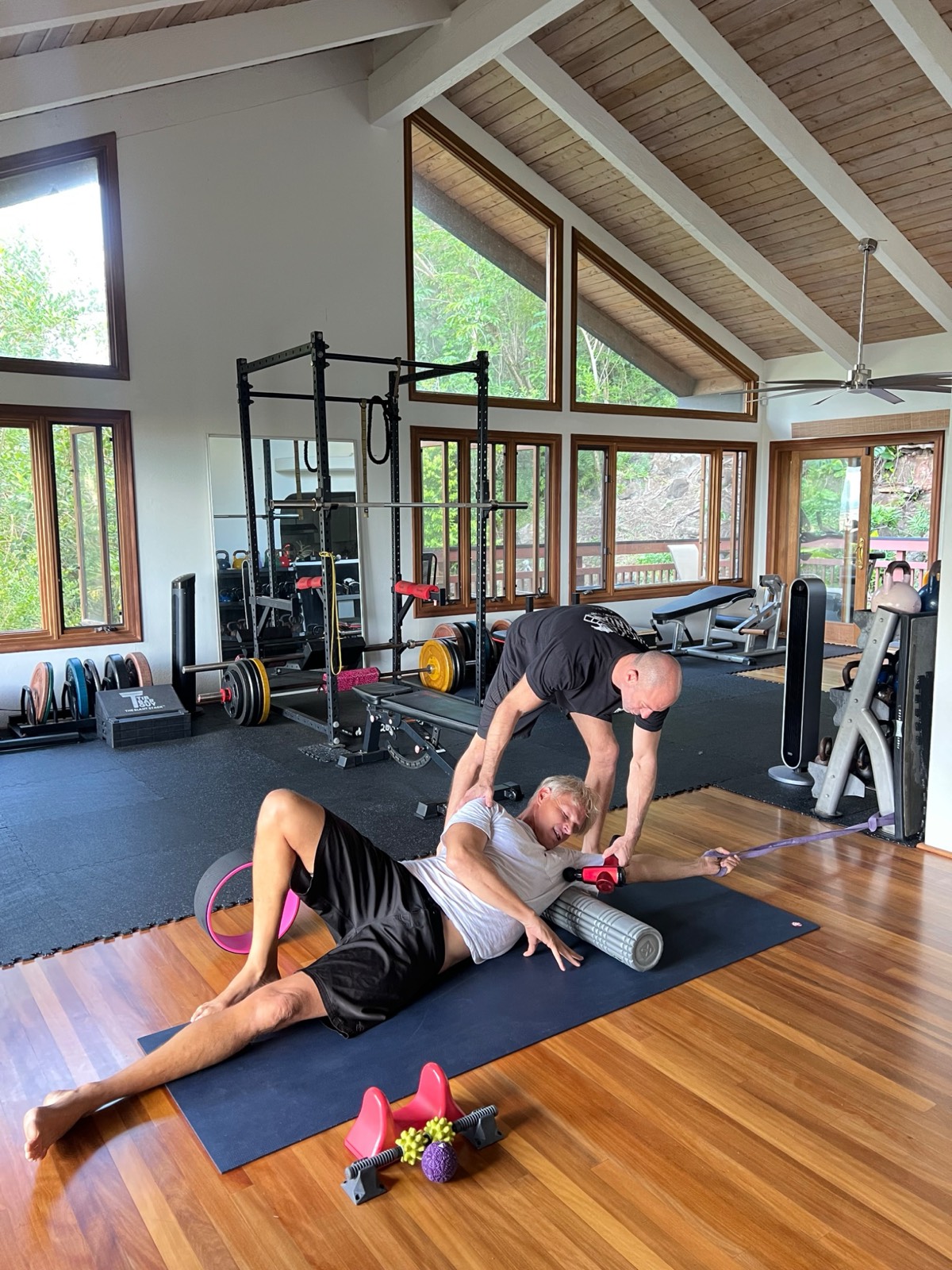 Dan Kayser working hands-on with a client on lower back pain recovery